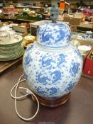A large blue & white Oriental table lamp.