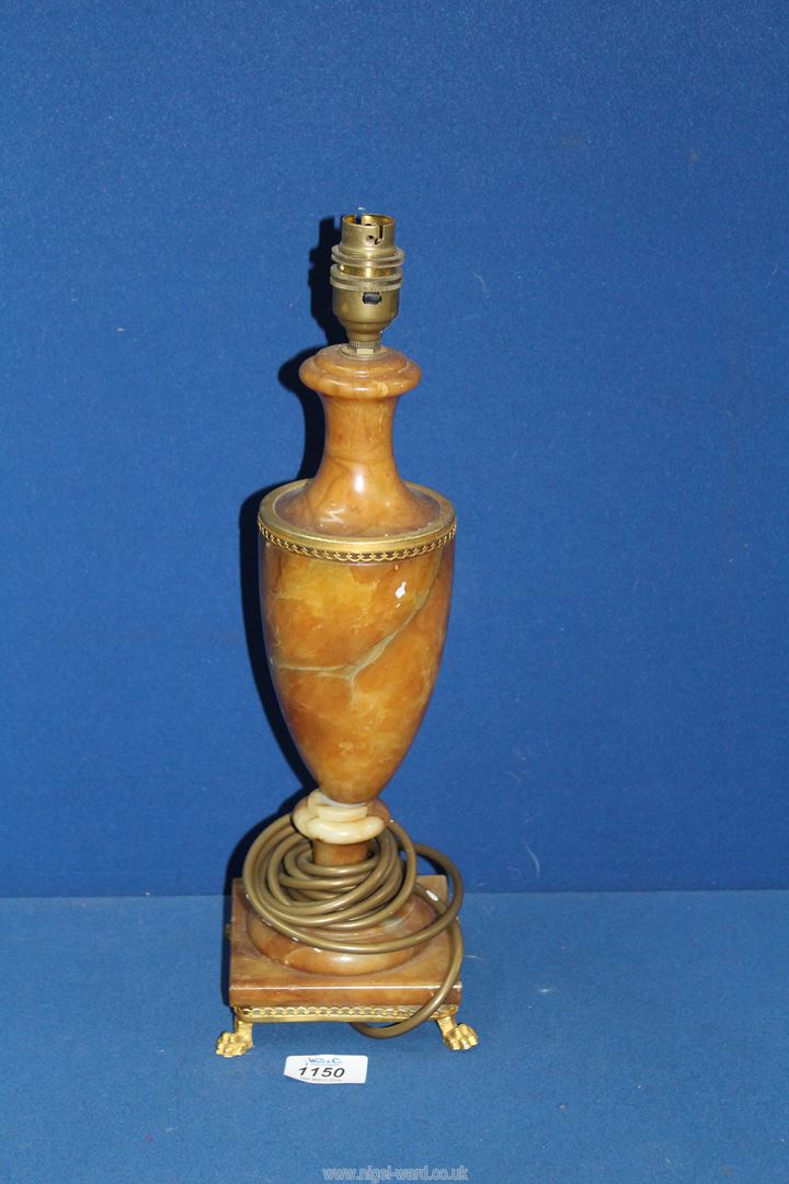 A Marble table lamp with brass detail and stand, 15 1/2" tall.