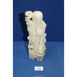 An Alabaster figure of a Sage, 9 1/2'' tall.