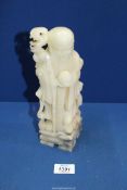 An Alabaster figure of a Sage, 9 1/2'' tall.