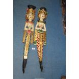 A pair of carved and painted, wall hanging figures of Thai/Balinese women, 32" tall.