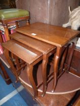 A Nest of three Mahogany rectangular occasional Tables, teh larges 19 1/2'' x 12 7/8'' x 20'' high,