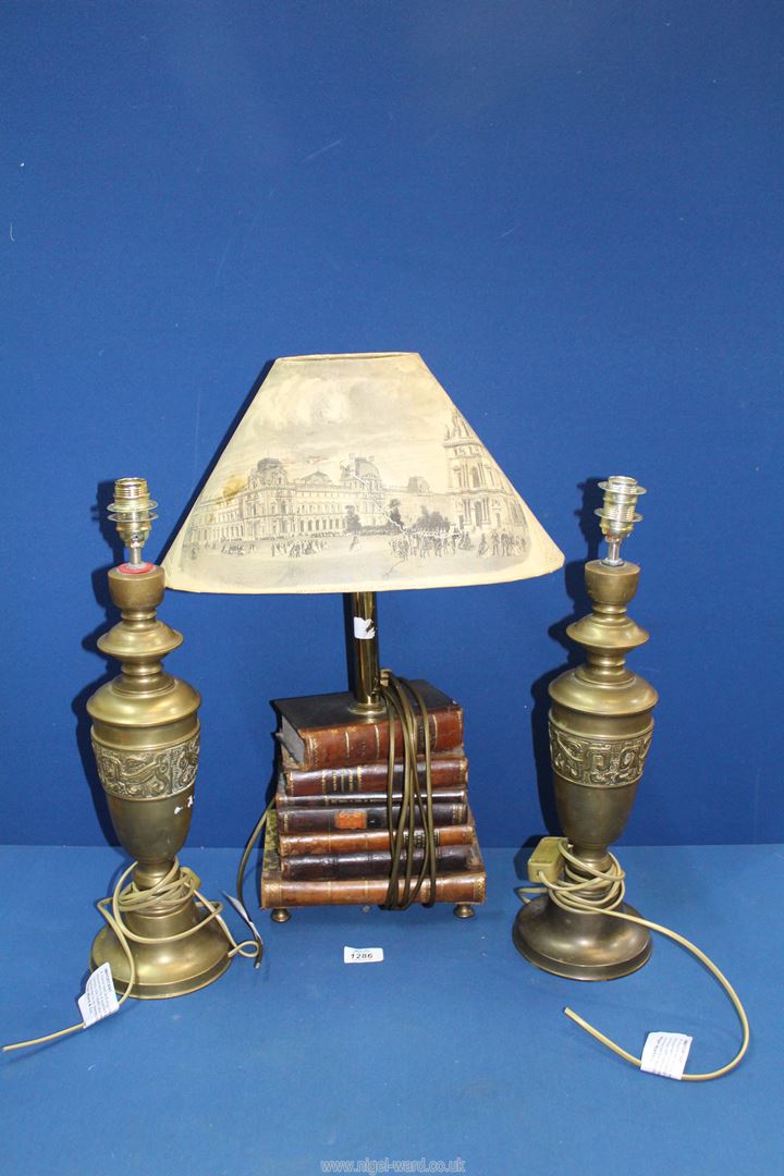 A lamp base made of stacked leather bound books with (Newspaper shade a/f) 22 1/2" tall and a pair