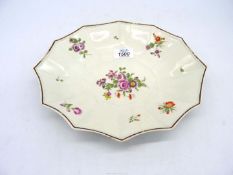 A Bristol/Worcester twelve sided plate with floral detail, chip to base, 11 1/2" x 9 1/2".