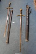 A pair of Swords with leather bound handles in leather sheaths.