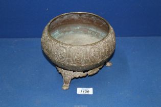 A Tibetan/Buddhist bowl on three paw feet, 7" diameter x 5" tall.