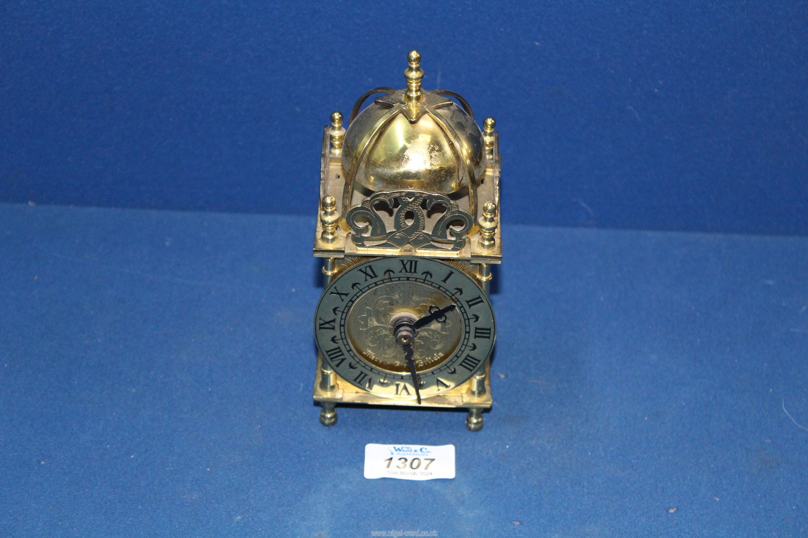 A small Lantern clock with battery movement.