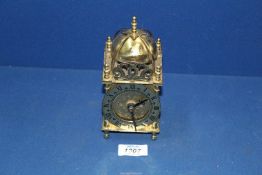 A small Lantern clock with battery movement.