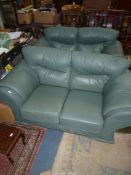 A pair of green hide upholstered Settees.
