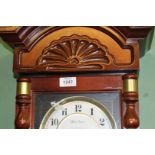 An Oak cased Wall Clock having a two train spring driven movement (ran briefly during lotting),