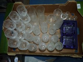 A quantity of glasses including wine, champagne flutes, water tumblers,