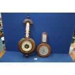 A Smiths Aneroid barometer and a carved barometer.