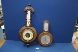 A Smiths Aneroid barometer and a carved barometer.