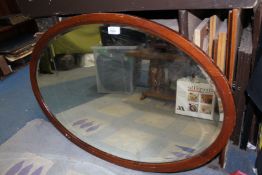 An oval bevel plated Mirror, 35'' x 24 1/2''.