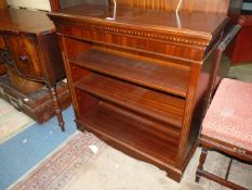 A contemporary Mahogany floor standing Bookshelves having a dentil frieze and adjustable shelving,