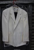 A "James Barry" gents cream dinner jacket, size 46 and a pair of black dinner trousers,
