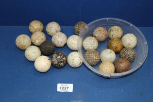 A quantity of 1910-1920 mesh pattern Golf balls and gutty and mesh pattern golf balls.