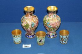 Three Russian 916 Silver Gilt and Enamel Vodka cups, one with circular plaque,