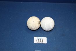 Two Bramble pattern gutty Golf Balls.