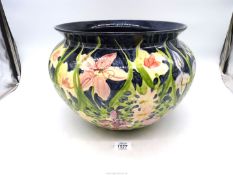 A hand painted blue floral Jardiniere, 14" diameter.