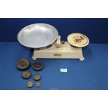 A vintage set of Harper kitchen scales and imperial weights.