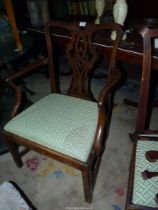 An elegant Georgian Mahogany carver Chair having arms with swept supports,