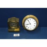 A Marpro small Bulkhead clock and a small brass desk clock.