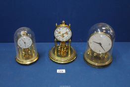 Three anniversary clocks; two with plastic domes and one without to include; Tempora and Bentima.