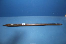An Australian Aboriginal throwing club with slightly faceted shaft and dark brown patina,