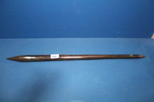 An Australian Aboriginal throwing club with slightly faceted shaft and dark brown patina,