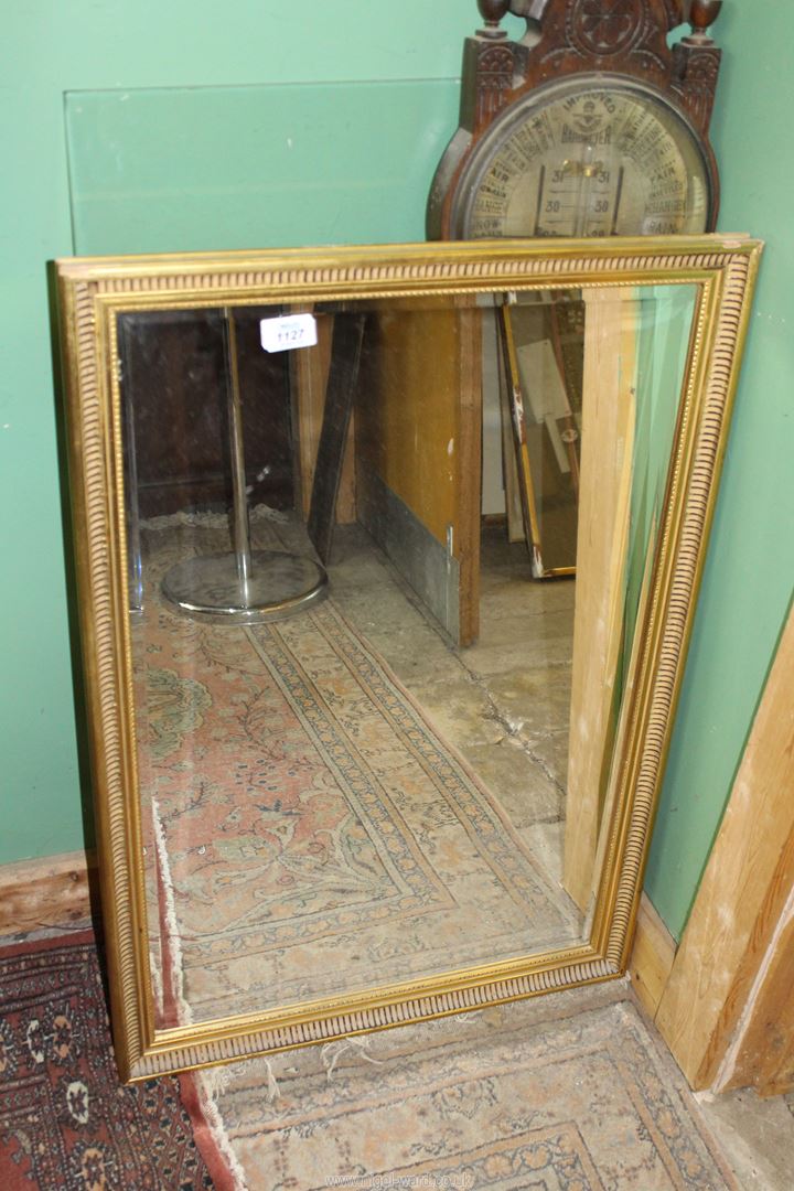 A gilded finished framed bevelled wall-hanging Mirror, 21 1/2'' x 32 1/2'' approx.