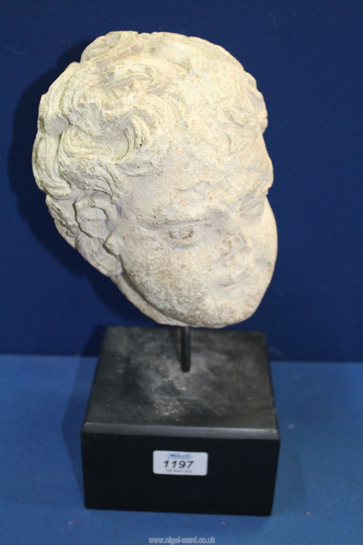A very early life size marble head from a free standing figure of a young child.
