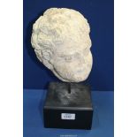 A very early life size marble head from a free standing figure of a young child.