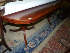 A Regency design double pedestal Dining Table having "D" ends,