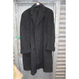 A Gents black Crombie overcoat for Austin Reed, single vent with turn back cuffs, size 44 approx.