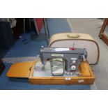 A Victor electric Sewing Machine, cased.