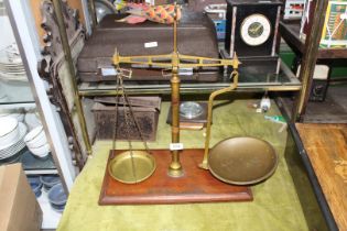 A 'Class B' Avery W&T brass Balance scales, on wooden stand, 18" wide x 22" high.