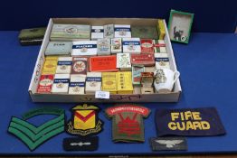 A quantity of old cigarette packets and tobacco tins each filled with cigarette cards,