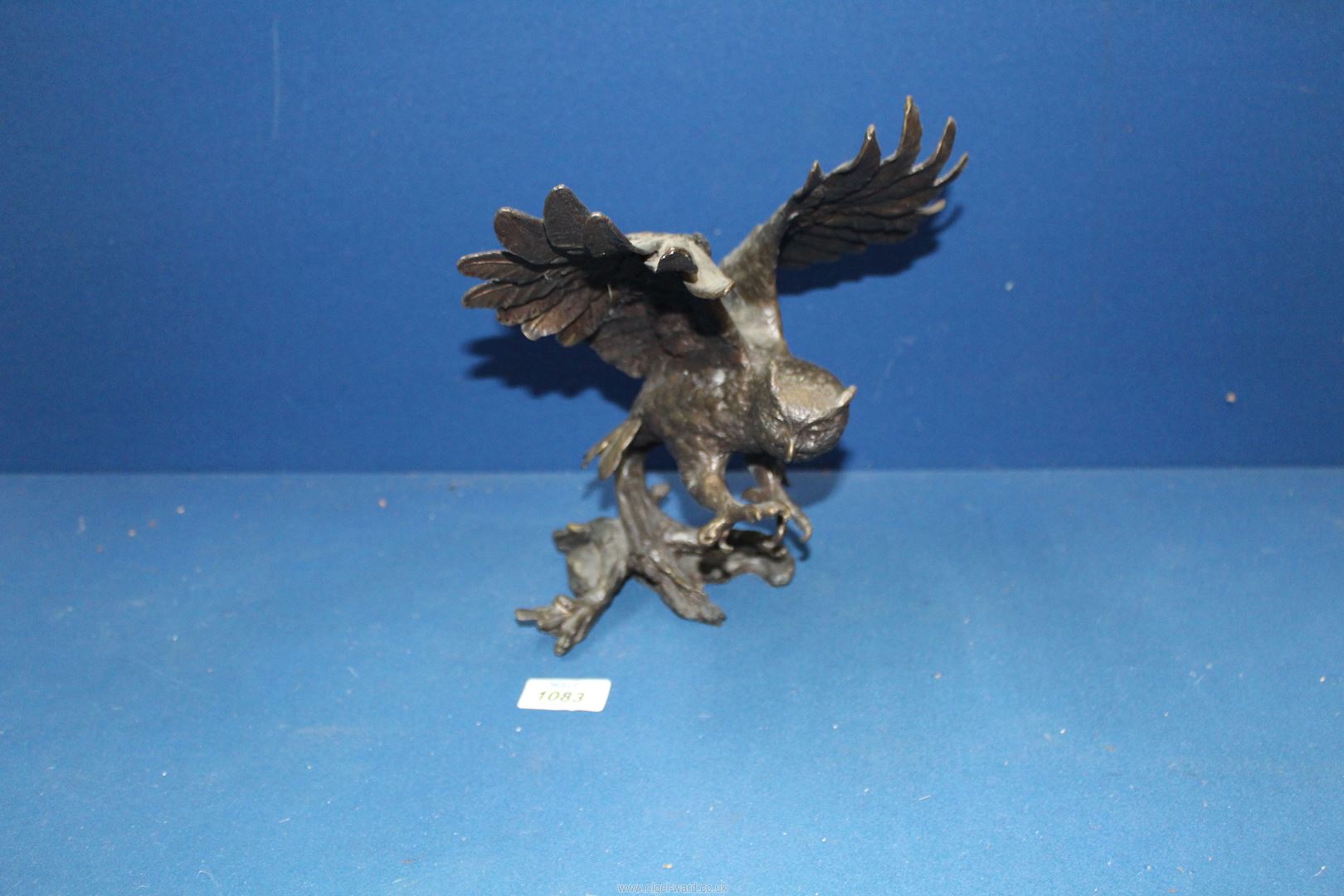 A heavy cast metal model of an Owl, 10" tall.
