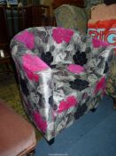 A stylish low backed "D"-shaped Armchair stylishly upholstered in grey ground pale grey,