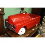 A child's red Pedal car, a/f.