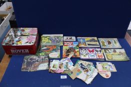 A box of cigarette cards including albums, postcards, etc.