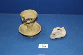 A fine early Islamic terracotta oil lamp,