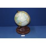 A Chad Valley tin plate Clock in form of a globe, 11" tall.