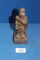 An early Chinese woodcarving of a flautist, probably Ming dynasty, 6'' tall.