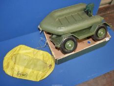 An Action Man dingy with trailer and inflatable life raft.