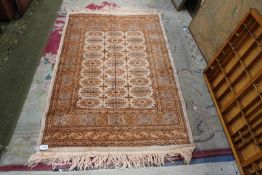 A small Afghan rug with fringed ends, 47" x 27".