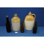 Three Victorian bottles and two earthenware bottles, one marked 'T.H.