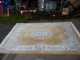 A pale yellow ground, bordered patterned and fringed Chinese Rug, 7 ft wide.