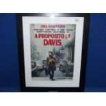 A reproduction 'Propositito Di Davis' framed poster.